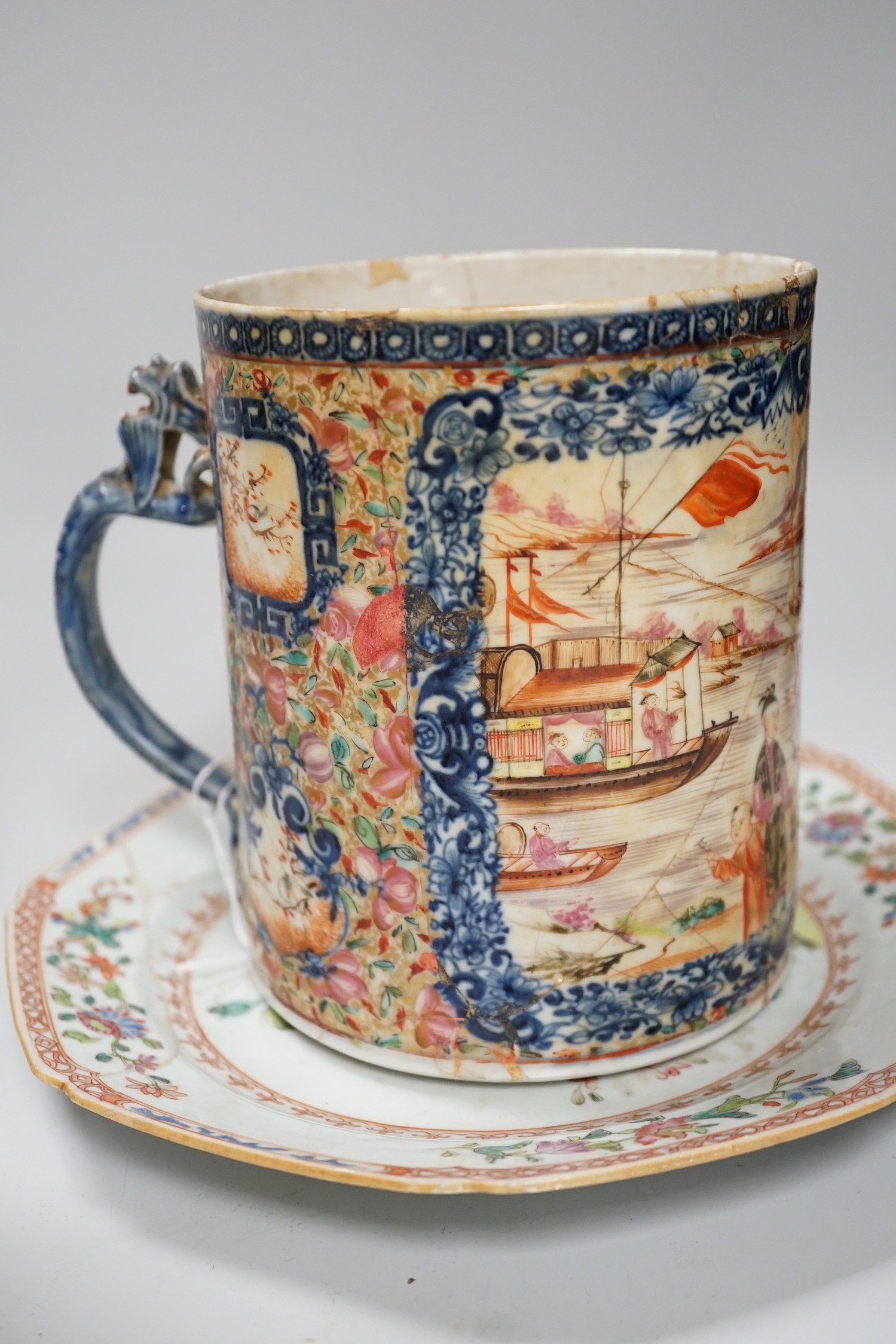 A Chinese figure of blanc de chine, a dragon tea bowl, a saucer, a large tankard, and another Chinese dish, tallest 23cm